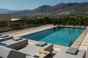 a swimming pool with a view of the mountains at Villa Alquimia Aa with private Swimming pool in Hersonissos