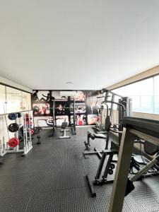 a gym with treadmills and equipment in a room at Apto com Estilo e Conforto no Centro in Petrolina