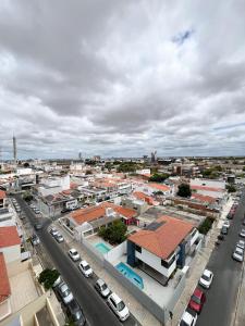 an aerial view of a city with cars parked at Apto com Estilo e Conforto no Centro in Petrolina