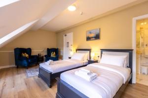 En eller flere senge i et værelse på Whitegates Hotel + 7 billeder