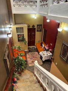 a living room with a couch and a table at La Casona de Palacio Viejo in Arequipa