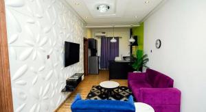 TV a/nebo společenská místnost v ubytování Raj Holidays Homes