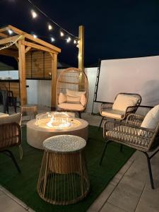 a group of chairs and tables on a patio at Madeira Beach Family & Pet Friendly Luxury Getaway in Seminole