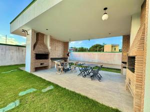 Μια τηλεόραση ή/και κέντρο ψυχαγωγίας στο Casa com 2 quartos no Frances