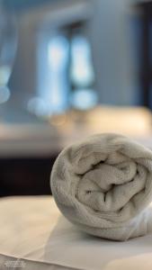 a roll of white rope sitting on top of a table at Hostel Lybeer Private Rooms just for two! in Bruges