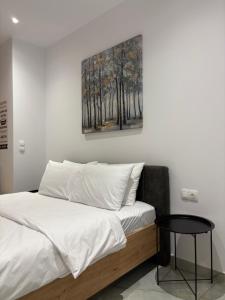 Ένα ή περισσότερα κρεβάτια σε δωμάτιο στο Elysion