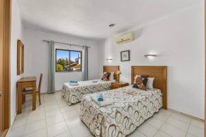 Ένα ή περισσότερα κρεβάτια σε δωμάτιο στο Villa Eira by Villa Plus +18 φωτογραφίες