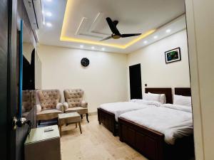 Postel nebo postele na pokoji v ubytování Gateway Resdencia