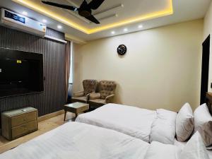 Postel nebo postele na pokoji v ubytování Gateway Resdencia + 6 fotografií