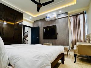 Postel nebo postele na pokoji v ubytování Gateway Resdencia