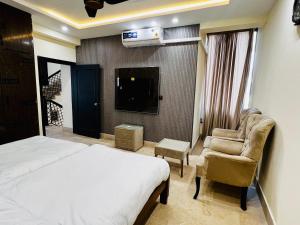 TV a/nebo společenská místnost v ubytování Gateway Resdencia