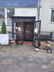 a entrance to a building with a glass door at Selmas Pensionat in Vittsjö