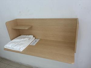a wooden shelf with a bed in a room at Hotel Los Proceres in La Aurora +23 photos