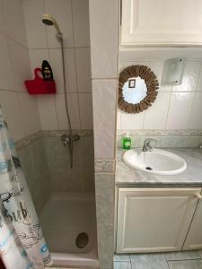 a bathroom with a shower and a sink at Casa Tesoreta in Cala en Forcat