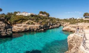 a view of a river with blue water at Casa Tesoreta in Cala en Forcat