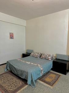 Postel nebo postele na pokoji v ubytování Cosy apartment Hassan Rabat