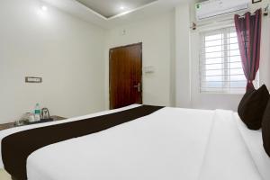 Ένα ή περισσότερα κρεβάτια σε δωμάτιο στο Hotel O Aqua Comforts