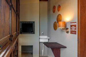 Et tv og/eller underholdning på Residencial Lares do Rosa