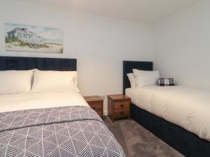 En eller flere senge i et værelse på The Farm House