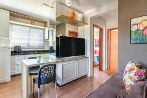 Et tv og/eller underholdning på Residencial Lares do Rosa