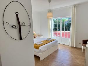 a bedroom with a bed and a large mirror at Serenity Cascais Villa in Cascais