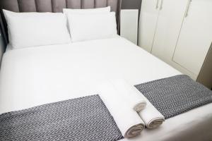 En eller flere senge i et værelse på Grace View Guest House - Fourways