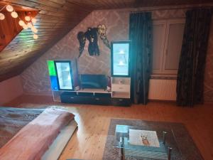 a living room with a couch and a mirror at Apartmán GRAND Lučenec in Lučenec