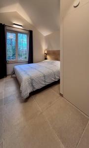 Кровать или кровати в номере Idyllic cottage with wellness facilities