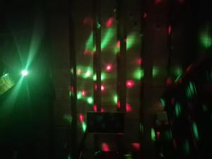 a room with green and red lights on the wall at AA Frame Retreat Fundata in Fundata