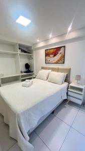 Ένα ή περισσότερα κρεβάτια σε δωμάτιο στο Israel Flat com vista para o mar na orla de Tambaú +14 φωτογραφίες