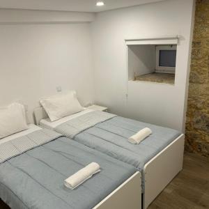 Ένα ή περισσότερα κρεβάτια σε δωμάτιο στο Albergue Ultreya