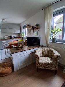 Kuchyň nebo kuchyňský kout v ubytování Ferienwohnung MiJo, mit Charme und Ostseenah + 14 fotografií