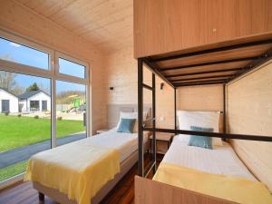 Ένα ή περισσότερα κρεβάτια σε δωμάτιο στο Comfortable, single-story holiday homes