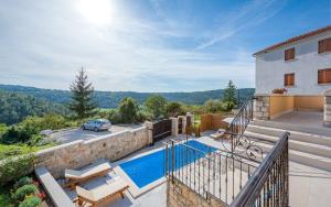 a villa with a swimming pool and a house at Villa Beram in Pazin