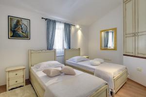 a bedroom with two beds and a window at Villa Beram in Pazin +34 photos