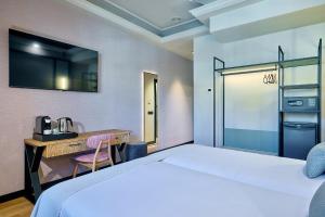 Postel nebo postele na pokoji v ubytování Boutique Hotel Luna Triunfo Granada