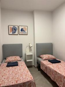 Ένα ή περισσότερα κρεβάτια σε δωμάτιο στο Apartment with rooftop pool 150 m from the beach