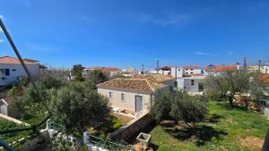 a view of a city with houses and trees at Vasilikis Place in Elafonisos