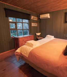 Ένα ή περισσότερα κρεβάτια σε δωμάτιο στο Casa Taller Meular Chiloé
