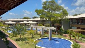 an image of a swimming pool at a resort at Itacimirim Bioflora 69 in Itacimirim