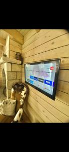 a sauna with a tv in the corner of a room at Agréable petite maison rustique in Saint-Geniès-de-Varensal