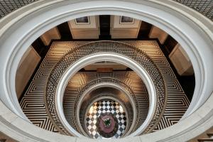 a view of a spiral staircase in a building at The Edinburgh Grand, a Luxury Collection Hotel, Edinburgh in Edinburgh