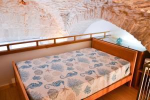 En eller flere senge i et værelse på Dimora Marina