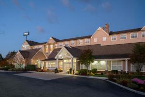 a hotel with a parking lot in front of it at Residence Inn by Marriott Springfield Chicopee in Chicopee