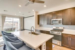 a kitchen with wooden cabinets and a kitchen island at Home Theater System and Gazebo Los Angeles Getaway! in San Fernando +18 photos