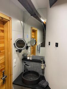 a bathroom with a sink and a mirror at Alpenfels Apartments - Zwieselstein in Sölden +67 photos