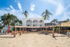 a resort on the beach with palm trees at Seres Sayulita Beach Hotel in Sayulita