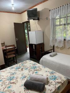 Ένα ή περισσότερα κρεβάτια σε δωμάτιο στο Espaço Riacho