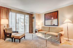a living room with a couch and a chair at MGM Signature-15-802 1Br 2Ba F1 Pits View Balcony in Las Vegas