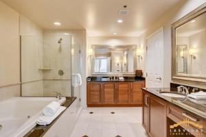 a bathroom with a tub and a shower and a sink at MGM Signature-15-802 1Br 2Ba F1 Pits View Balcony in Las Vegas